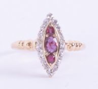 An antique 18ct yellow gold marquise shaped ring set with three oval cut rubies surrounded by old