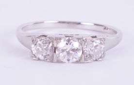 An 18ct white gold three stone ring set with three old cut diamonds, total diamond weight approx.