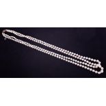Necklace, a fine double row of knotted cultured pearls, the overall length approx. 21" strung to a