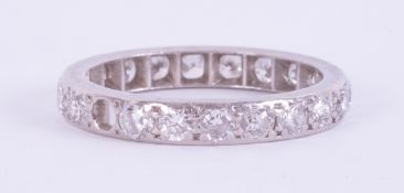 A platinum (not hallmarked or tested) full eternity ring set with round brilliant cut diamonds (
