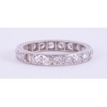 A platinum (not hallmarked or tested) full eternity ring set with round brilliant cut diamonds (