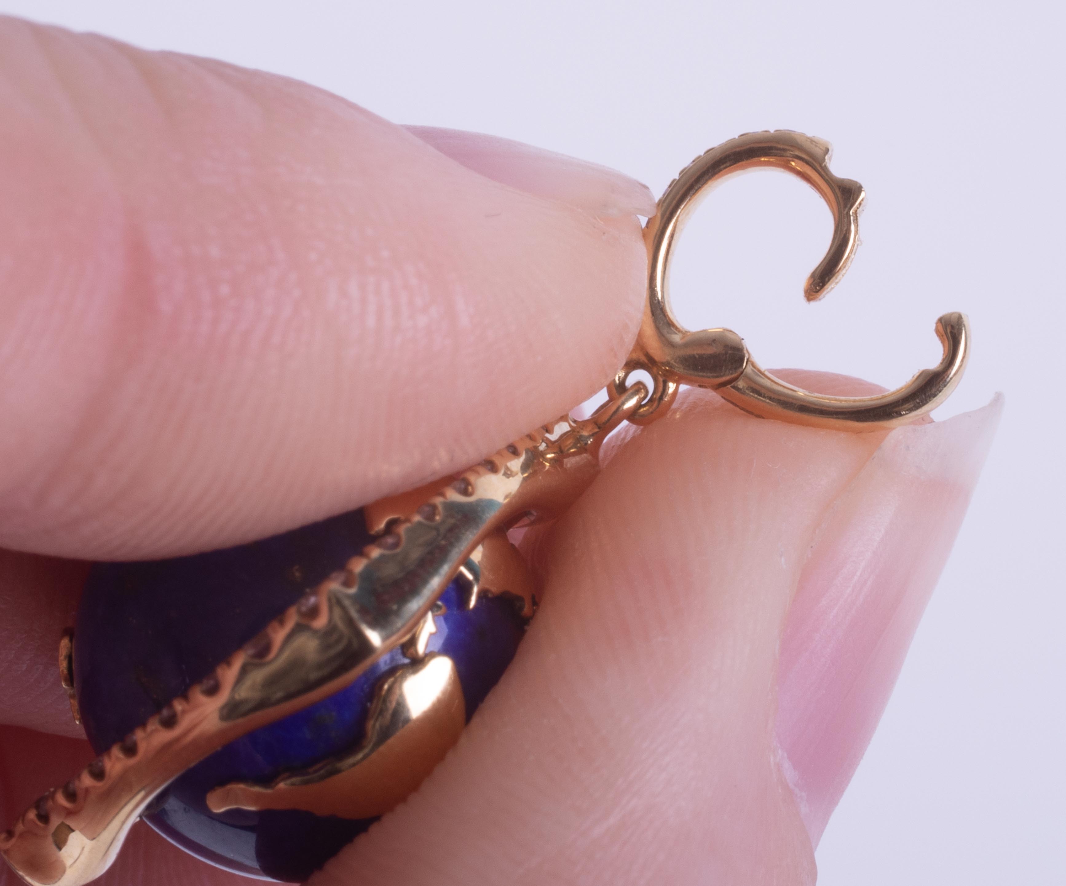 An 18ct yellow gold pendant set with a spinning lapis lazuli & gold 'World' surrounded by small - Image 7 of 7