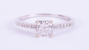 An 18ct white gold ring set with approx. 0.90 carats of cushion cut diamond, colour G-H and SI1