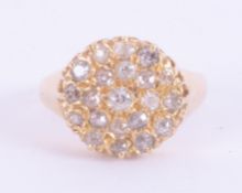 An antique 18ct yellow gold ring of a circular design set with old round cut diamonds, 7.17gm,