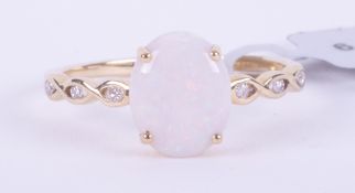 A 9ct yellow gold ring set with a 1.55 carat white oval cabochon cut opal from the Coober Pedy