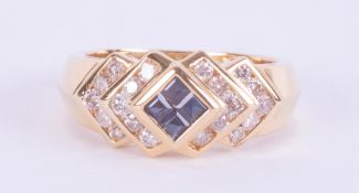 An 18ct yellow gold ring set centrally with four princess cut sapphires, total weight approx. 0.25