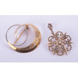 A 14ct yellow & white gold engraved swirl brooch set with a 5.5mm cultured pearl, pin & safety catch