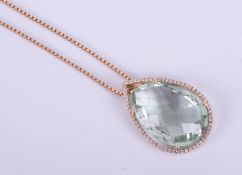 An 18ct yellow gold pear shaped pendant set with a faceted pear shaped green amethyst measuring