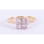 An 18k yellow & white gold ring set with four princess cut diamonds, total weight approx. 0.60