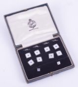 A set of 9ct white gold dress studs, cufflinks and collar studs with white mother of pearl and a