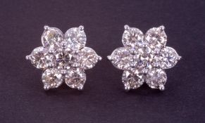 A pair of impressive large 18ct white gold flower cluster earrings set with round brilliant cut