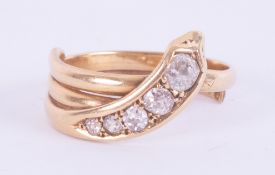 An 18ct yellow gold antique snake ring set with five old graduated round cut diamonds, approx. total