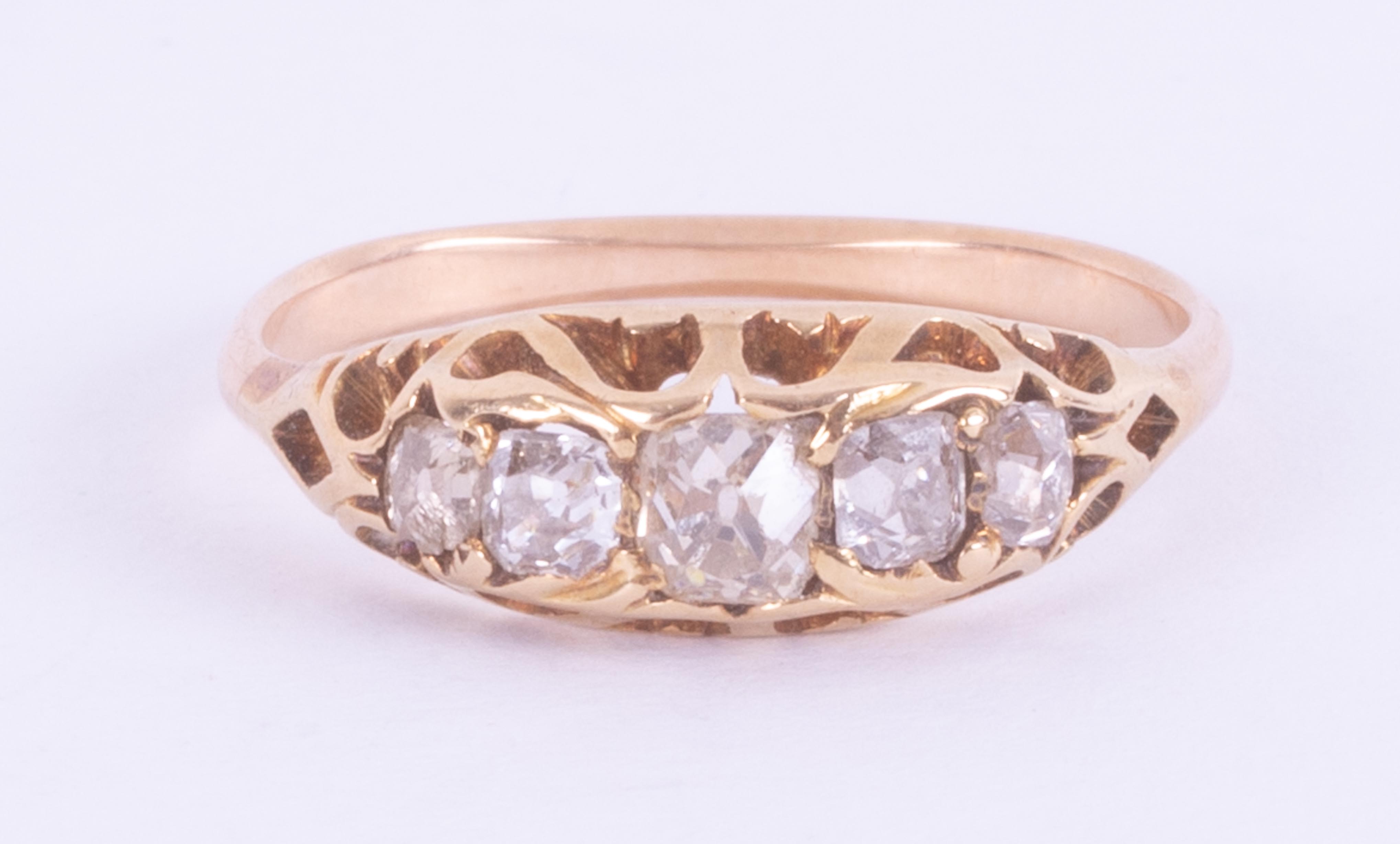 An antique yellow gold (not hallmarked or tested) five stone ring set with old cushion cut diamonds,