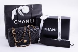 Chanel, a small classic quilted double flap Chanel bag in black leather with gold tone hardware,
