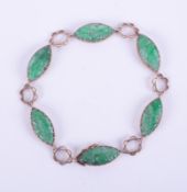 A 9ct yellow gold and jade bracelet, overall weight 11.1g.