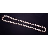 A string of knotted cultured white pearls with a creamy lustre, approx. average size 7.5mm, strung