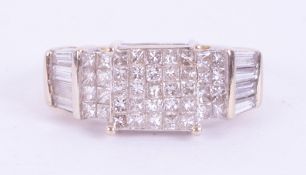 An 18ct yellow & white gold ring set with approx. 0.62 carats of princess cut diamonds and approx.