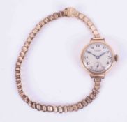 J.W.Benson, a ladies 9ct yellow gold wristwatch (dent to case).