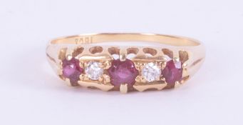 An 18ct yellow gold five stone ring set with three round cut rubies and two round cut diamonds, 2.