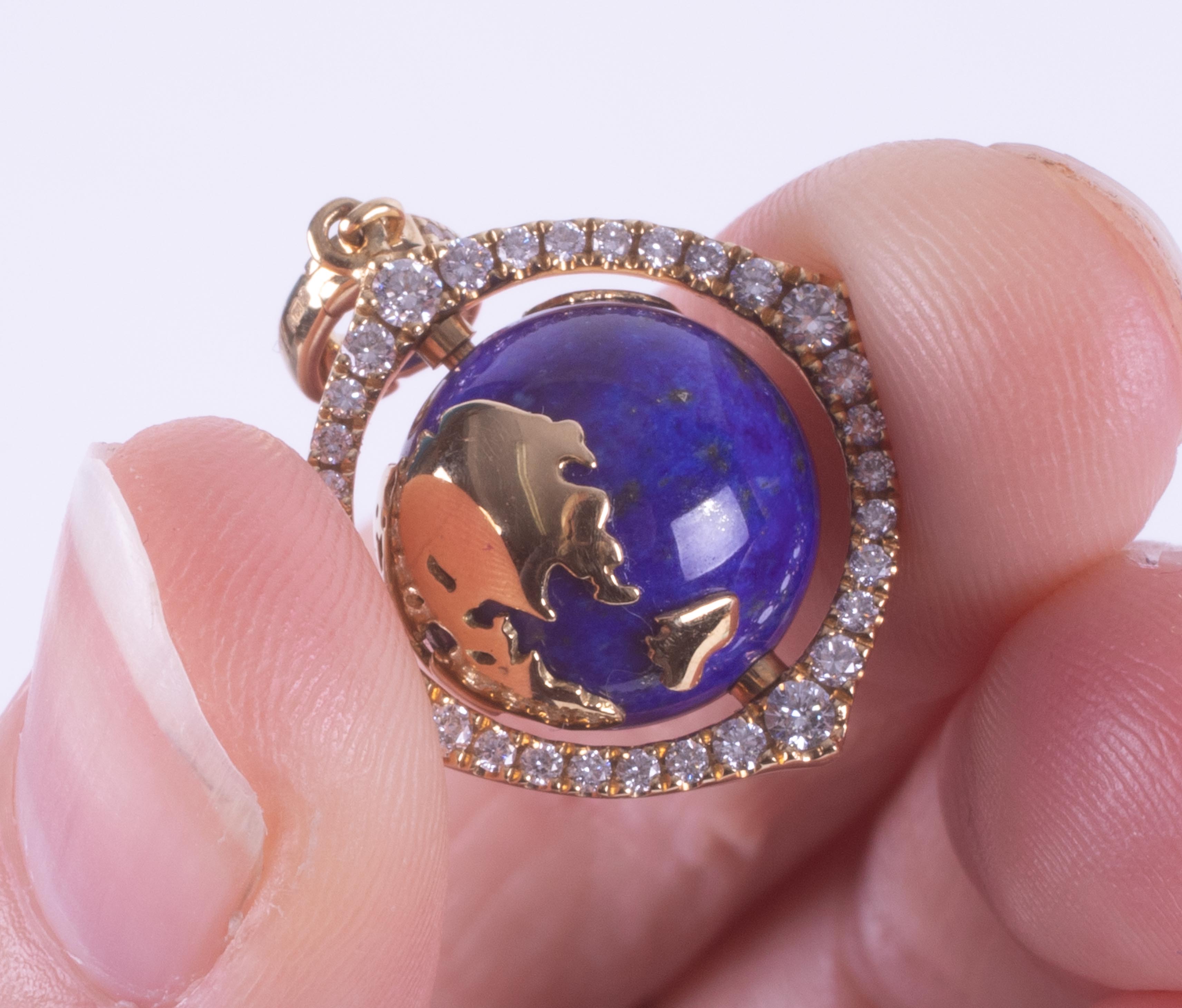 An 18ct yellow gold pendant set with a spinning lapis lazuli & gold 'World' surrounded by small - Image 3 of 7