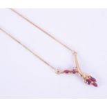 A 9ct yellow gold necklace set with five marquise shaped rubies and a small round brilliant cut