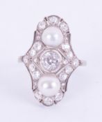 An Art Deco 1930's white gold (not tested or hallmarked) ring set with two 6.5mm white pearls, a