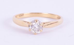 An 18ct yellow gold ring set with a round brilliant cut diamond, 0.33 carats, colour G and SI1
