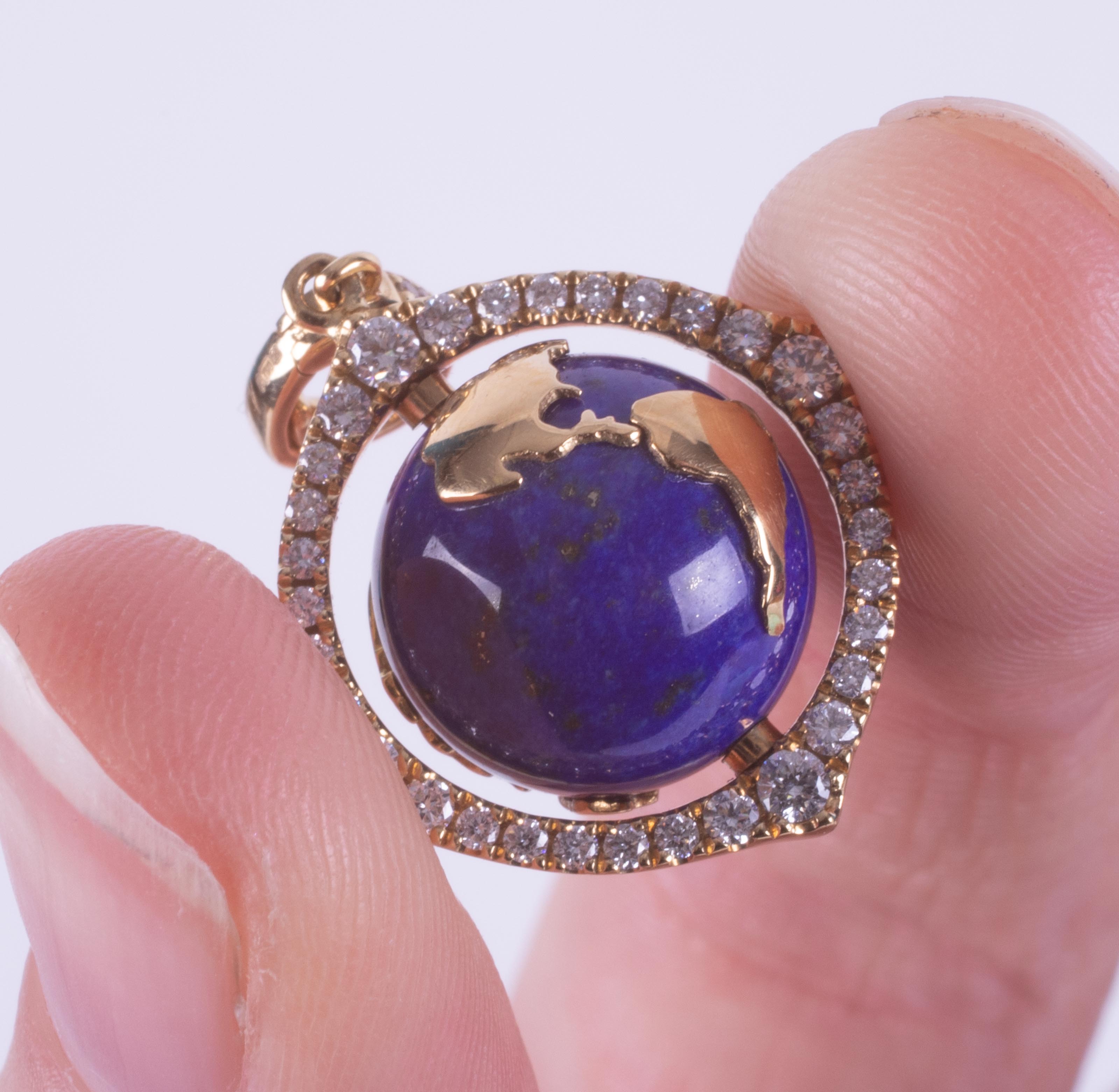 An 18ct yellow gold pendant set with a spinning lapis lazuli & gold 'World' surrounded by small - Image 2 of 7