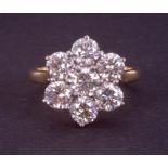 An impressive 18ct yellow & white gold flower cluster ring set with round brilliant cut diamonds,