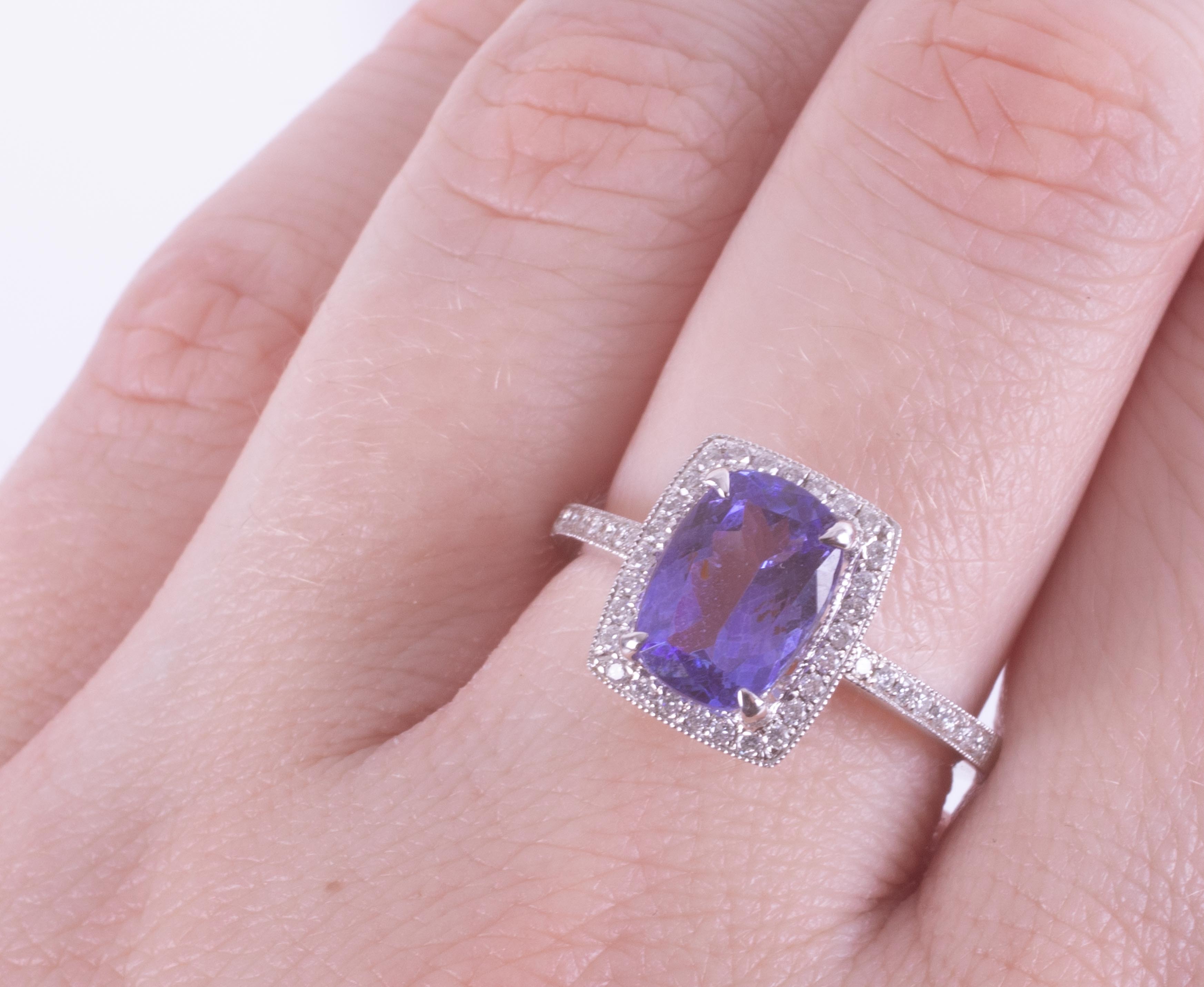 A 14k white gold cluster ring set with a central cushion cut Tanzanite, approx. 2.10 carats, - Image 2 of 2