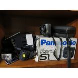 A Panasonic VHS movie camera, a Nikon Coolpix 995 camera, and a Canon Ixus digital camera, etc (