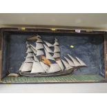 RESTORATION PROJECT PAINTED WOODEN RELIEF OF A SAILING SHIP IN DISPLAY CASE (A/F)
