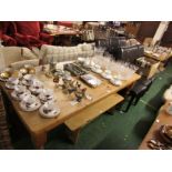 RECTANGULAR PINE DINING TABLE ON TURNED LEGS MATCHED WITH A SET OF SIX BROWN LEATHERETTE DINING