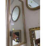 Rectangular narrow wall mirror in gold coloured frame