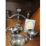 Small quantity of plated items including photograph frame, milk jugs and three-branch candle holder
