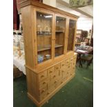 SUBSTANTIAL MODERN PINE DRESSER WITH THREE GLAZED DOORS TO TOP WITH INTERNAL ADJUSTABLE SHELVES,