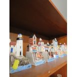 Seven Hazle ceramic models of buildings.