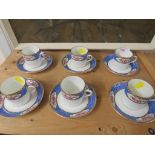 Six Taylor and Kent coffee cups and saucers with floral border.