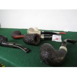 Six vintage tobacco pipes including K & P, one with silver band and a clay example.