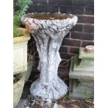 A COMPOSITE STONE RUSTIC BIRDBATH