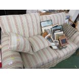BEIGE AND STRIPED COLOURED TWO-SEATER SOFA WITH SCATTER CUSHIONS.