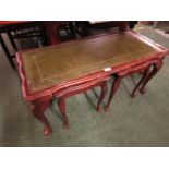MAHOGANY VENEER COFFEE TABLE WITH A PAIR OF NESTING TABLES.