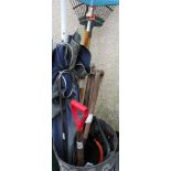 *revised photo* A METAL GARDEN WASTE BIN CONTAINING ASSORTED GARDENING TOOLS INCLUDING RAKES, SHOVEL
