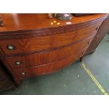 MAHOGANY AND MID WOOD VENEER BOW-FRONTED CHEST WITH FEATHER BANDING, DECORATIVE BRASS HANDLES AND