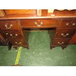 MAHOGANY SEVEN-DRAWER KNEEHOLE DESK WITH BRASS HANDLES STANDING ON CABRIOLE FEET (A/F)