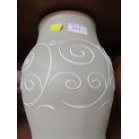 Pale green glazed Denby baluster vase with raised decoration.