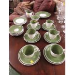 QUANTITY OF SUSIE COOPER CHINA TEA WARE, IN A PALE GREEN FINISH WITH WHITE SPOTS.