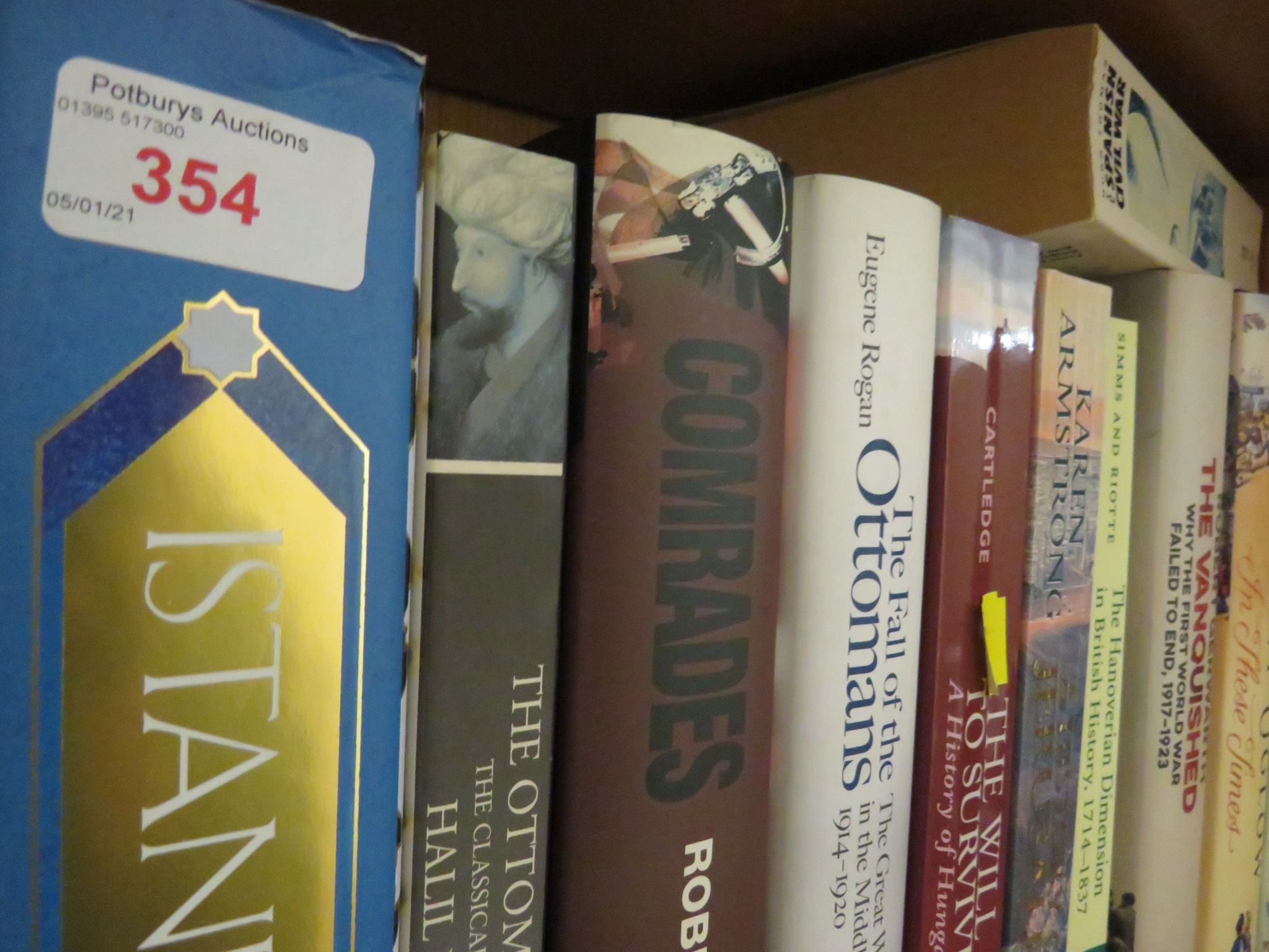 TWELVE SHELVES OF FICTION, HISTORY AND REFERENCE BOOKS.