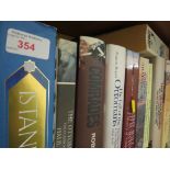 TWELVE SHELVES OF FICTION, HISTORY AND REFERENCE BOOKS.