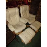 PAIR OF STRESSLESS SWIVEL RECLINING ARMCHAIRS WITH FOOT STOOLS IN CREAM LEATHER (A/F)